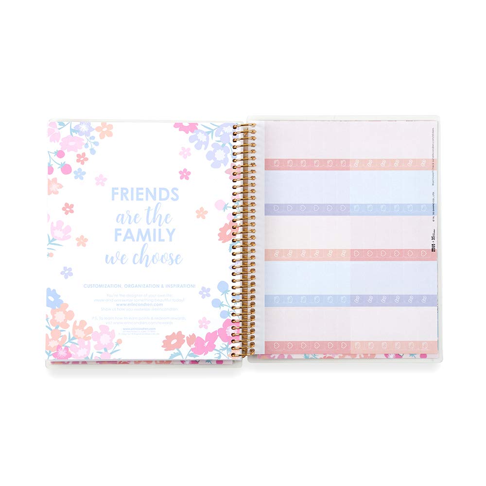 Open planner with floral design and motivational quote on left page, striped pattern on right page.