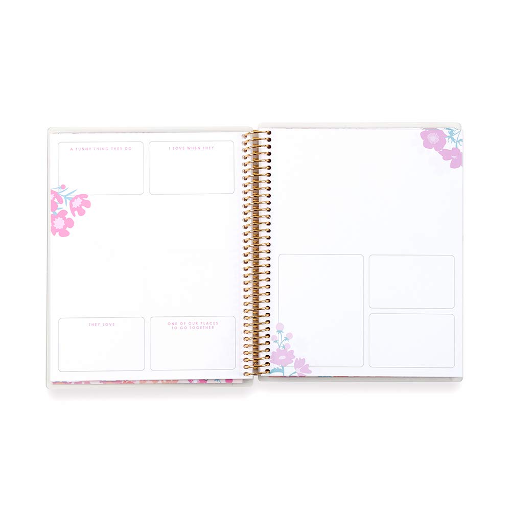 Open planner with floral design on a white background